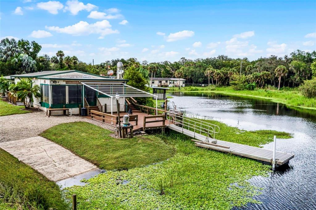 8270 Baxter Point North Mims, FL 32754 - Photo 34 of 50 an aerial view of a house with swimming pool garden and patio