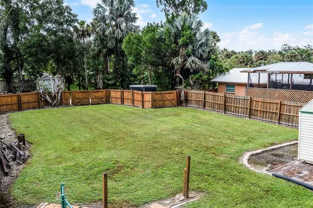 a view of a garden with a building in the background
