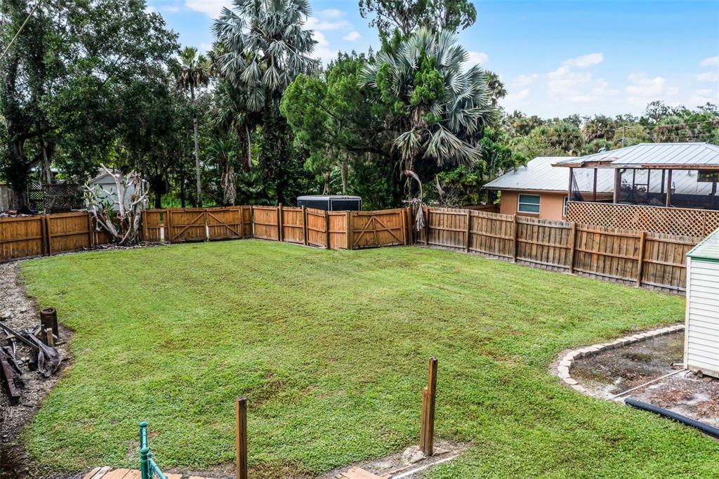 8270 Baxter Point North Mims, FL 32754 - Photo 37 of 50 a view of a backyard with a garden