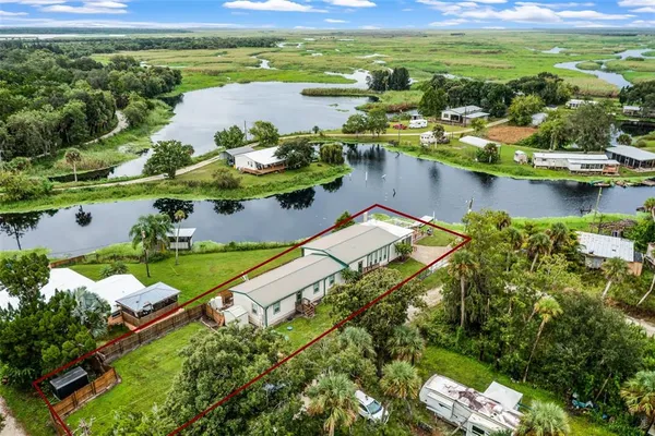 a view of a lake with a big yard