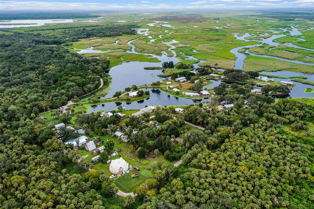 8270 Baxter Point North Mims, FL 32754 - Photo 49 of 50 a view of a lake with a houses