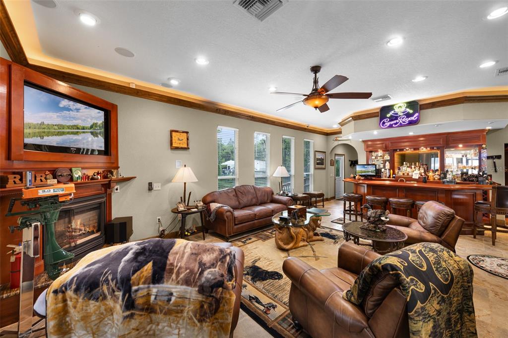 8270 Baxter Point North Mims, FL 32754 - Photo 10 of 50 a very nice looking living room with furniture and a flat screen tv