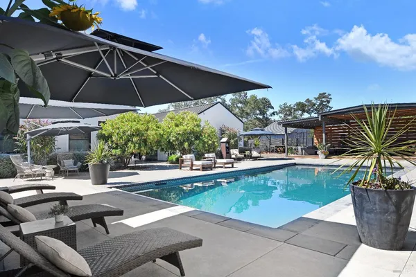 a view of a swimming pool with a patio