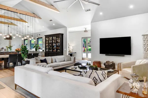 a bedroom with furniture and a window