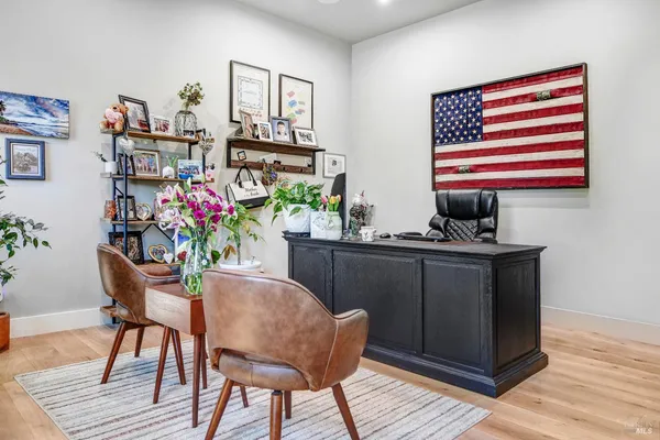 a spacious bedroom with a bed and a view of bathroom
