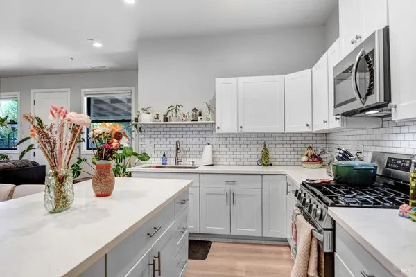 a view of an outdoor dining space with a table and chairs