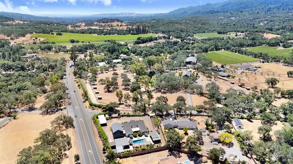 a view of an outdoor dining space with furniture and outdoor view