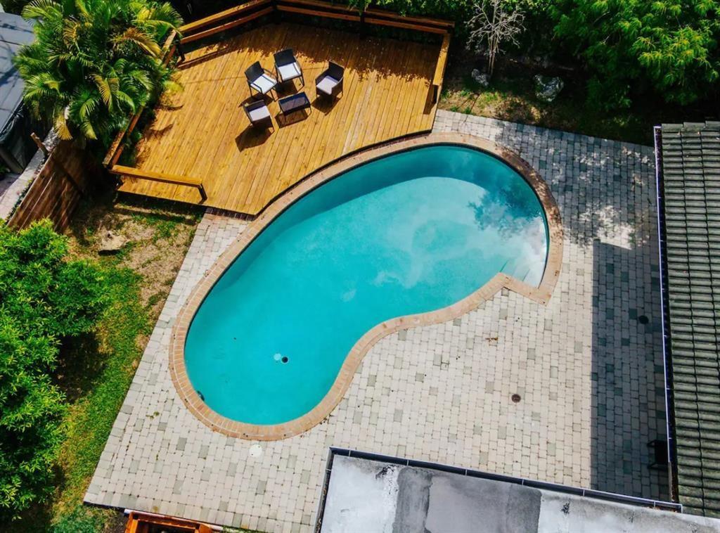 2521 Northeast 51st Street Lighthouse Point, FL 33064 - Photo 20 of 24 an aerial view of a swimming pool
