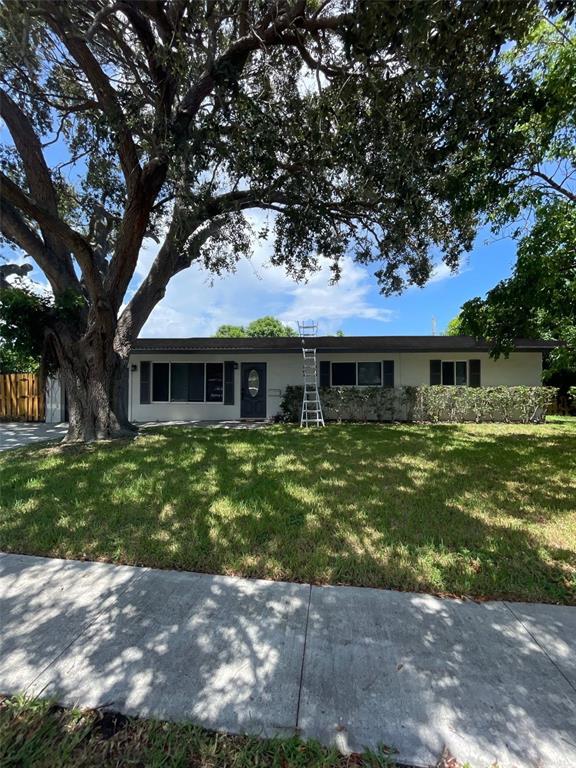 2521 Northeast 51st Street Lighthouse Point, FL 33064 - Photo 23 of 24 a front view of a house with a garden