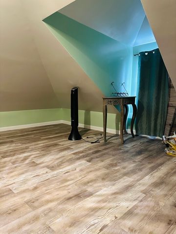 a kitchen with stainless steel appliances a stove a sink cabinets and a window