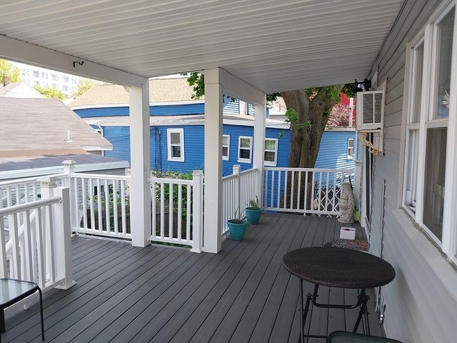 a view of front door with wooden floor