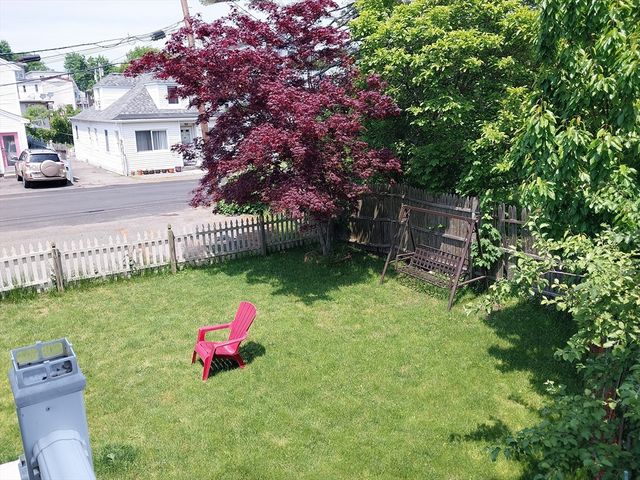 a front view of a house with parking space