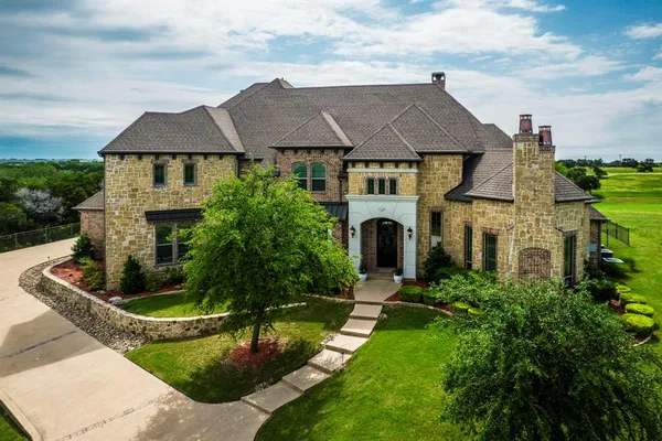 a front view of house with yard and green space