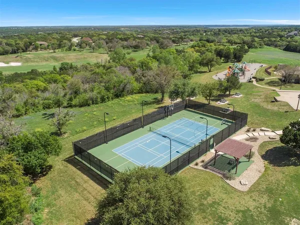 a view of a field with an ocean