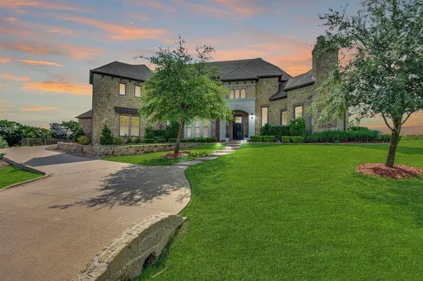 a front view of house with yard and green space