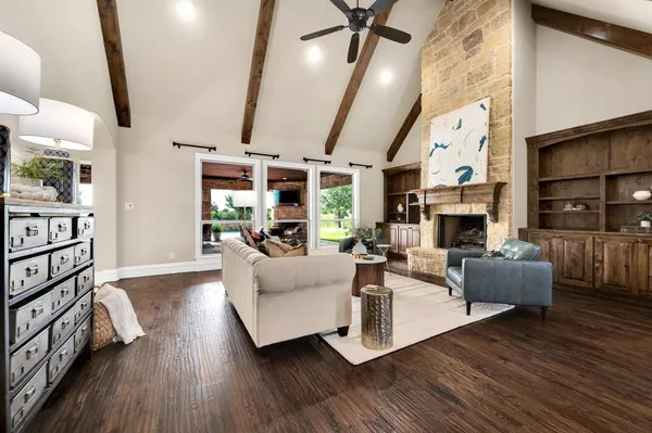 a living room with furniture fireplace and a flat screen tv