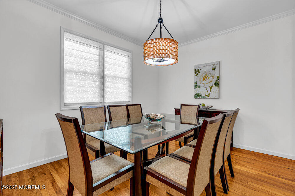 1825 Pine Terrace Lake Como, NJ 07719 - Photo 12 of 53 a view of a dining room with furniture wooden floor and a chandelier