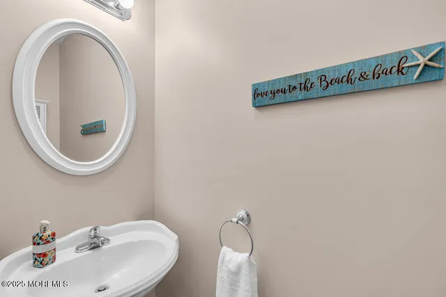 a close up of a sink and a mirror