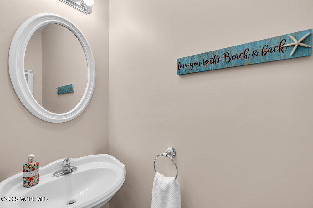 1825 Pine Terrace Lake Como, NJ 07719 - Photo 20 of 53 a close up of a sink and a mirror