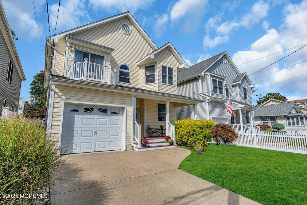 1825 Pine Terrace Lake Como, NJ 07719 - Photo 2 of 53 a front view of a house with a yard and garage