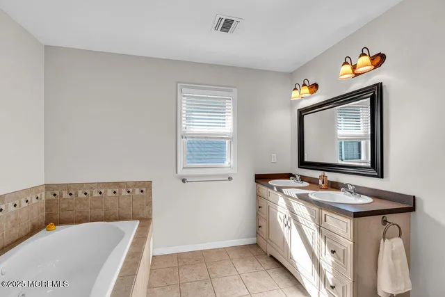 a bathroom with a bathtub and shower