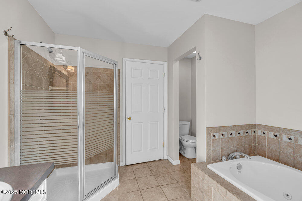 1825 Pine Terrace Lake Como, NJ 07719 - Photo 32 of 53 a bathroom with a bathtub and shower