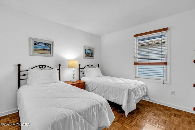 a bedroom with furniture and a window