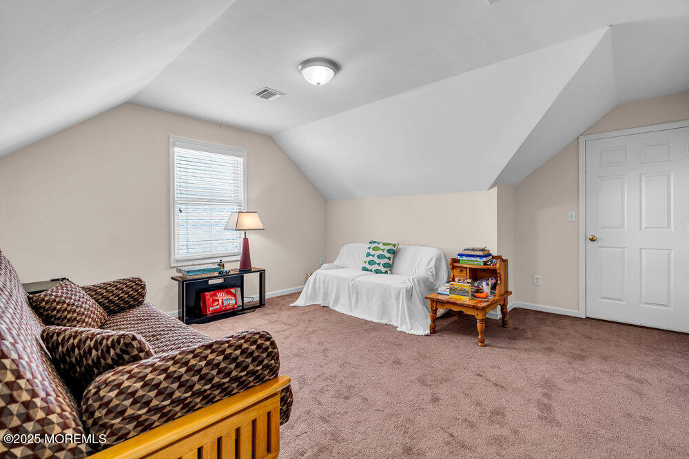 1825 Pine Terrace Lake Como, NJ 07719 - Photo 39 of 53 a bedroom with furniture and a window
