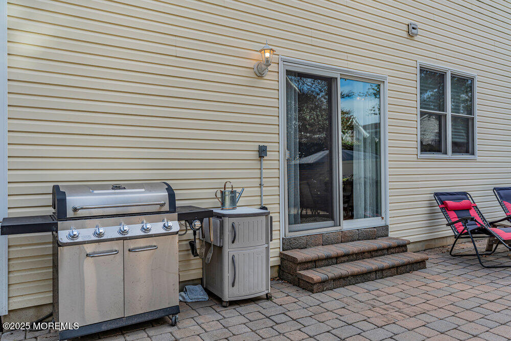 1825 Pine Terrace Lake Como, NJ 07719 - Photo 43 of 53 a view of a patio with table and chairs