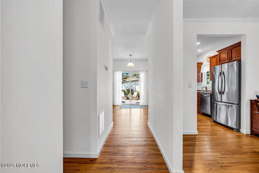 1825 Pine Terrace Lake Como, NJ 07719 - Photo 9 of 53 a view of a hallway with wooden floor and furniture