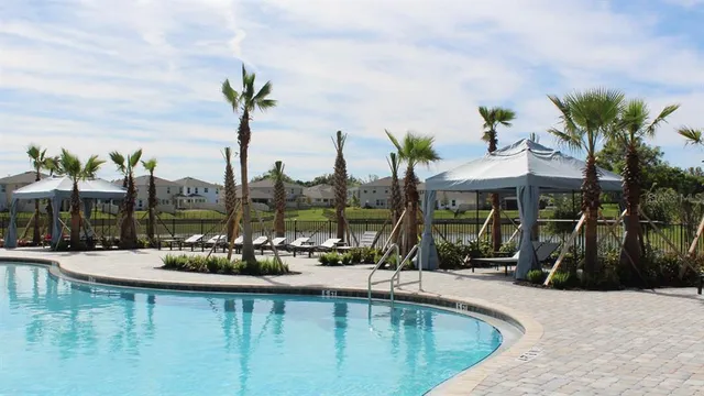 a view of a swimming pool with a patio