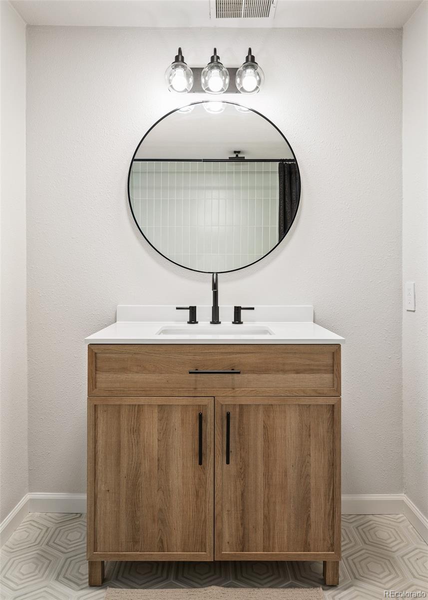 19424 Silver Ranch Road Conifer, CO 80433 - Photo 20 of 34 a bathroom with a sink and a mirror
