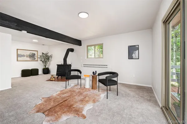 a bedroom with furniture and a mirror