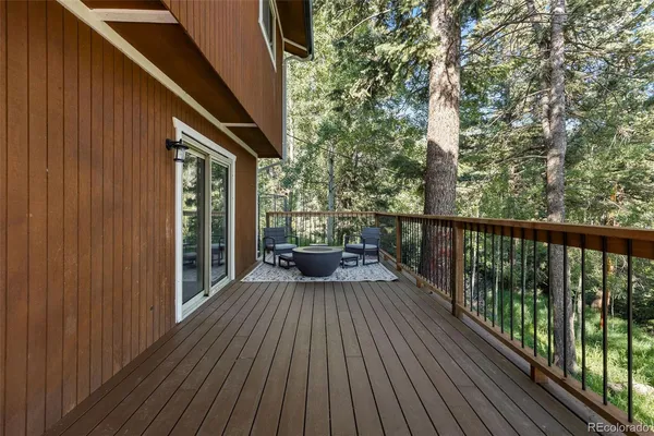 a view of a balcony with couch and wooden floor