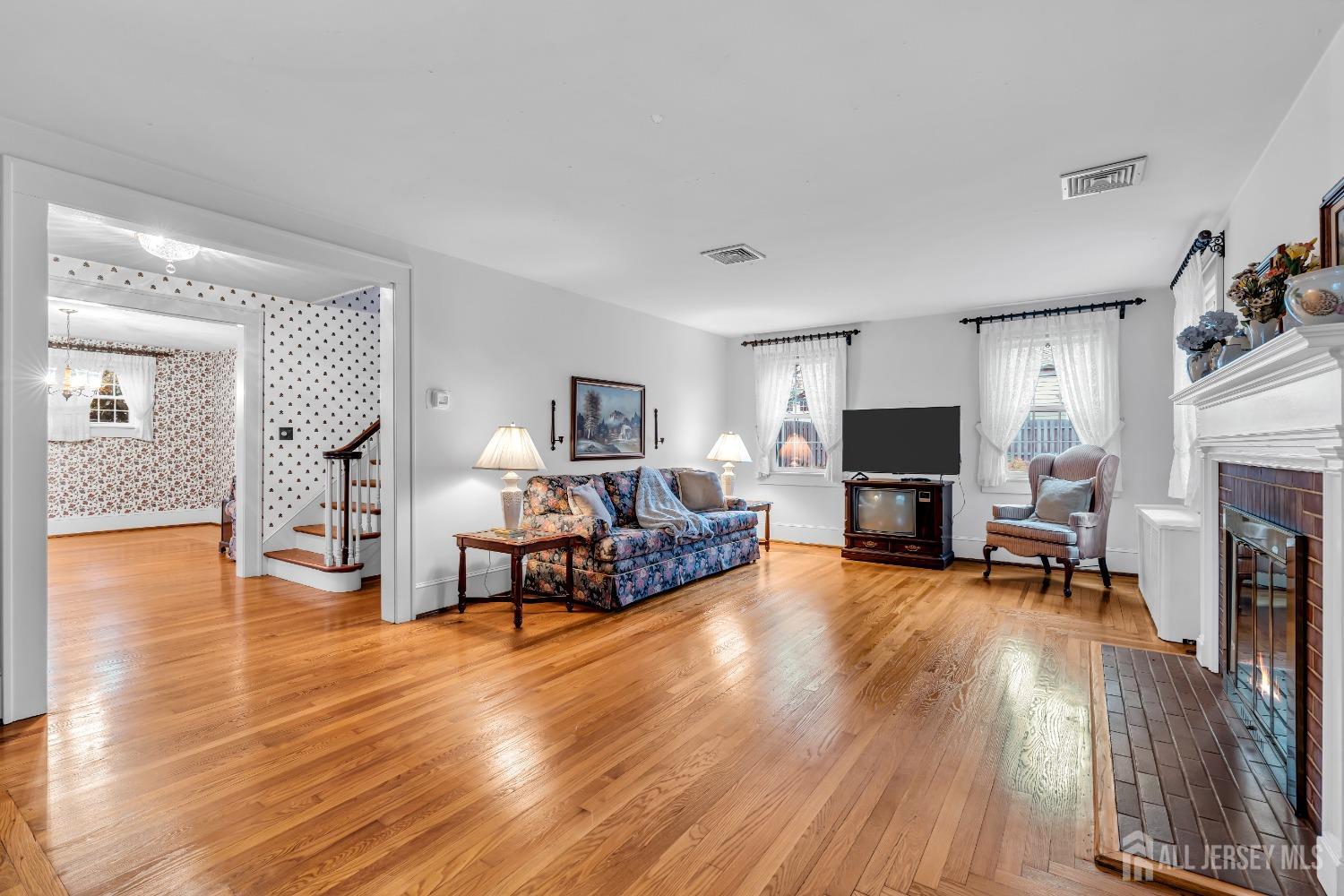 3 Edgemere Drive Matawan, NJ 07747 - Photo 13 of 43 a living room with furniture and a fireplace