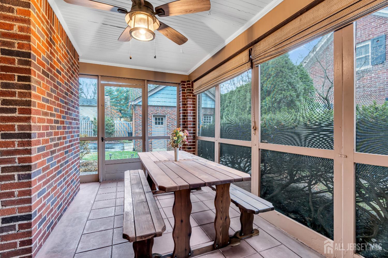 3 Edgemere Drive Matawan, NJ 07747 - Photo 15 of 43 a view of a patio with a tv table and chairs