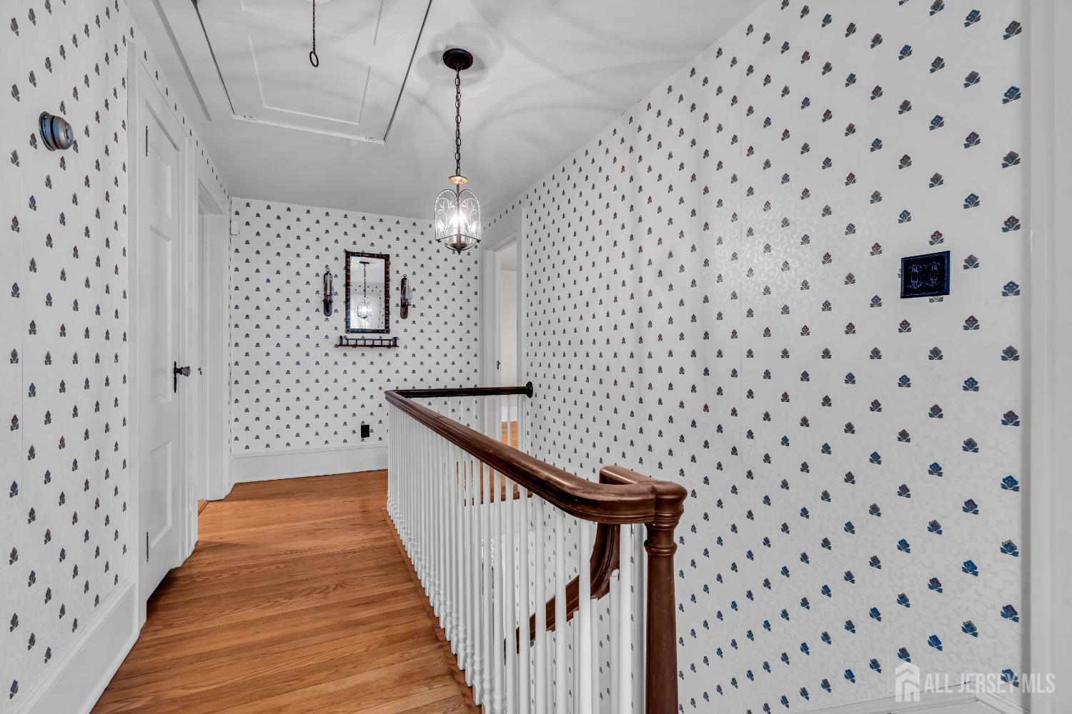 3 Edgemere Drive Matawan, NJ 07747 - Photo 17 of 43 a view of a hallway with wooden floor and staircase