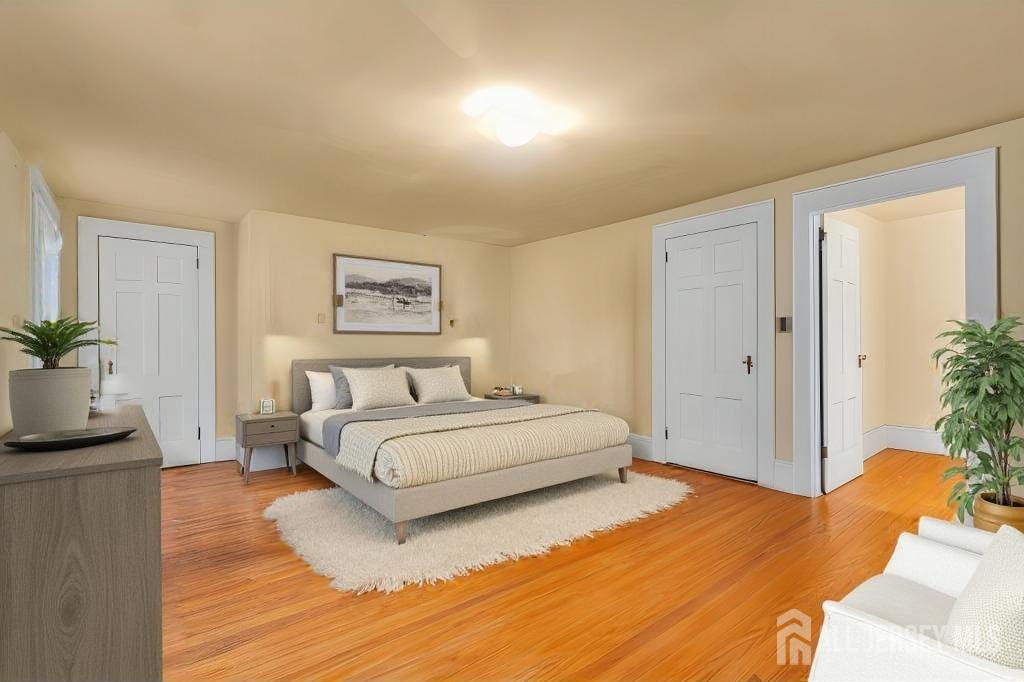 3 Edgemere Drive Matawan, NJ 07747 - Photo 20 of 43 a spacious bedroom with a bed and a couch
