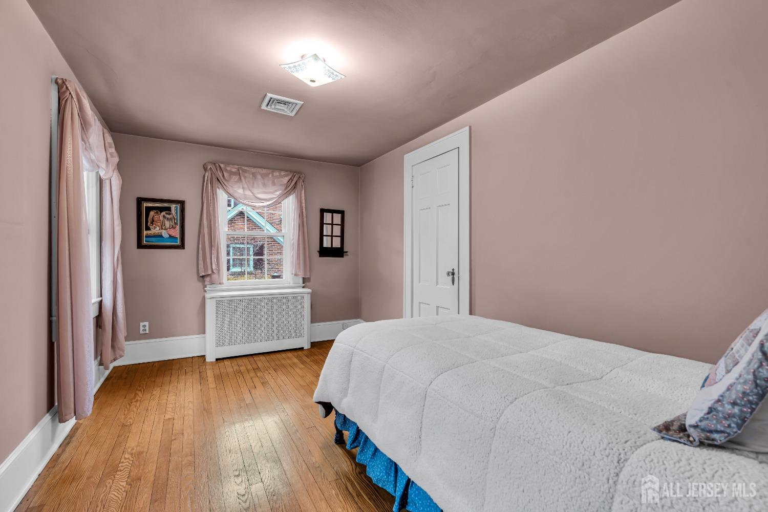 3 Edgemere Drive Matawan, NJ 07747 - Photo 24 of 43 a bedroom with a bed and a window