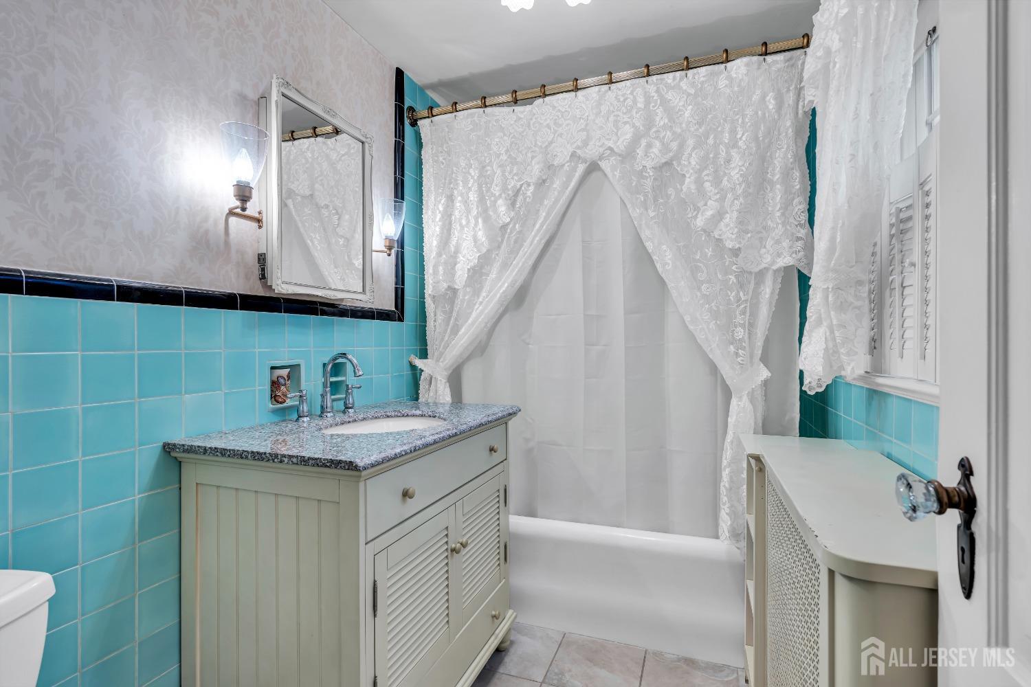 3 Edgemere Drive Matawan, NJ 07747 - Photo 28 of 43 a bathroom with a sink a mirror and a shower