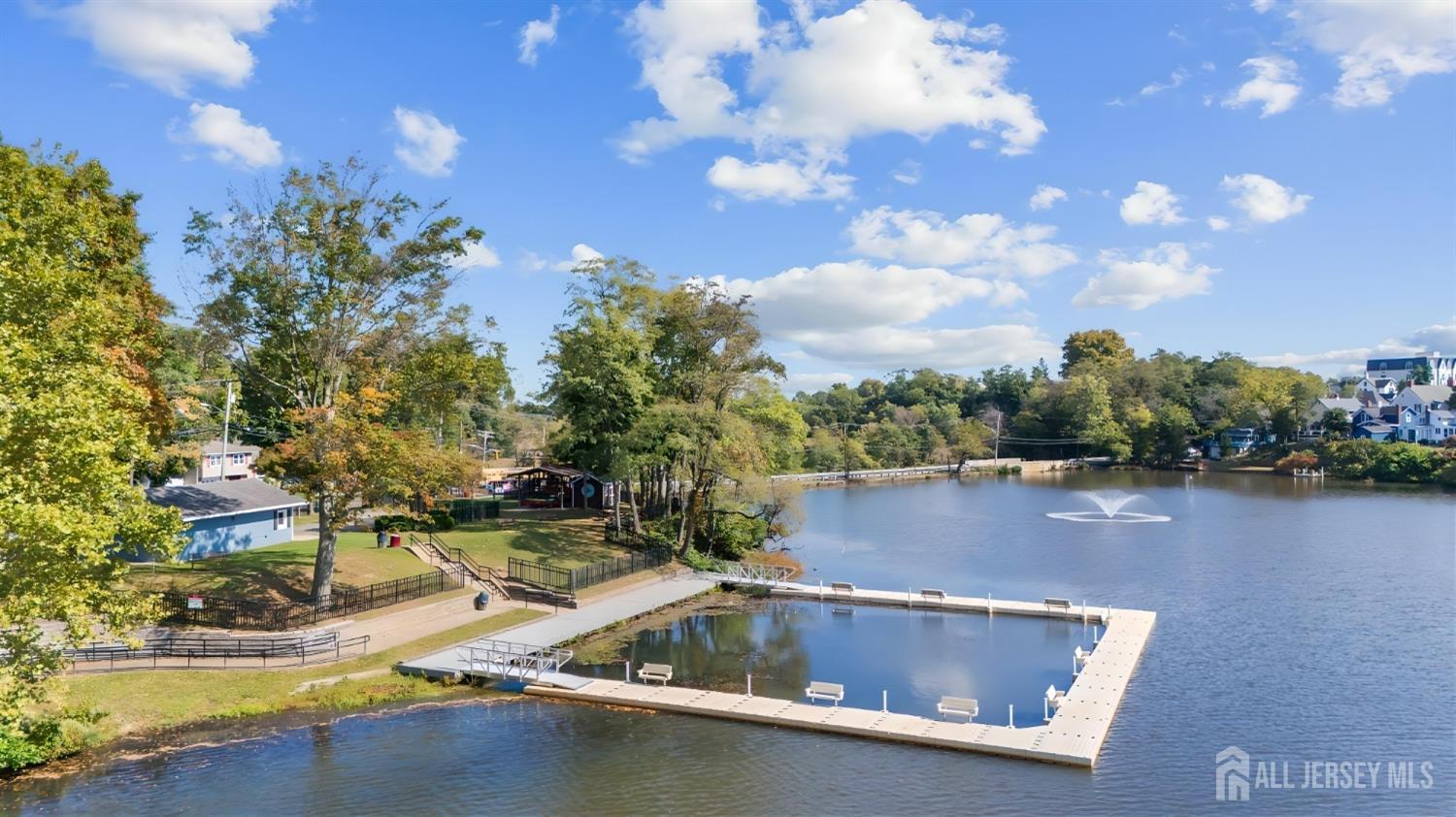 3 Edgemere Drive Matawan, NJ 07747 - Photo 42 of 43 a view of swimming pool with outdoor seating and lake in the back