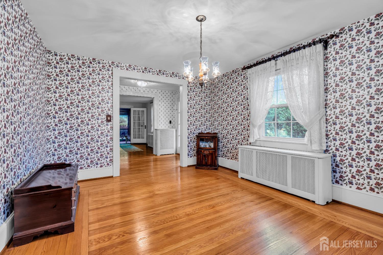 3 Edgemere Drive Matawan, NJ 07747 - Photo 7 of 43 a view of a room with wooden floor fireplace and windows