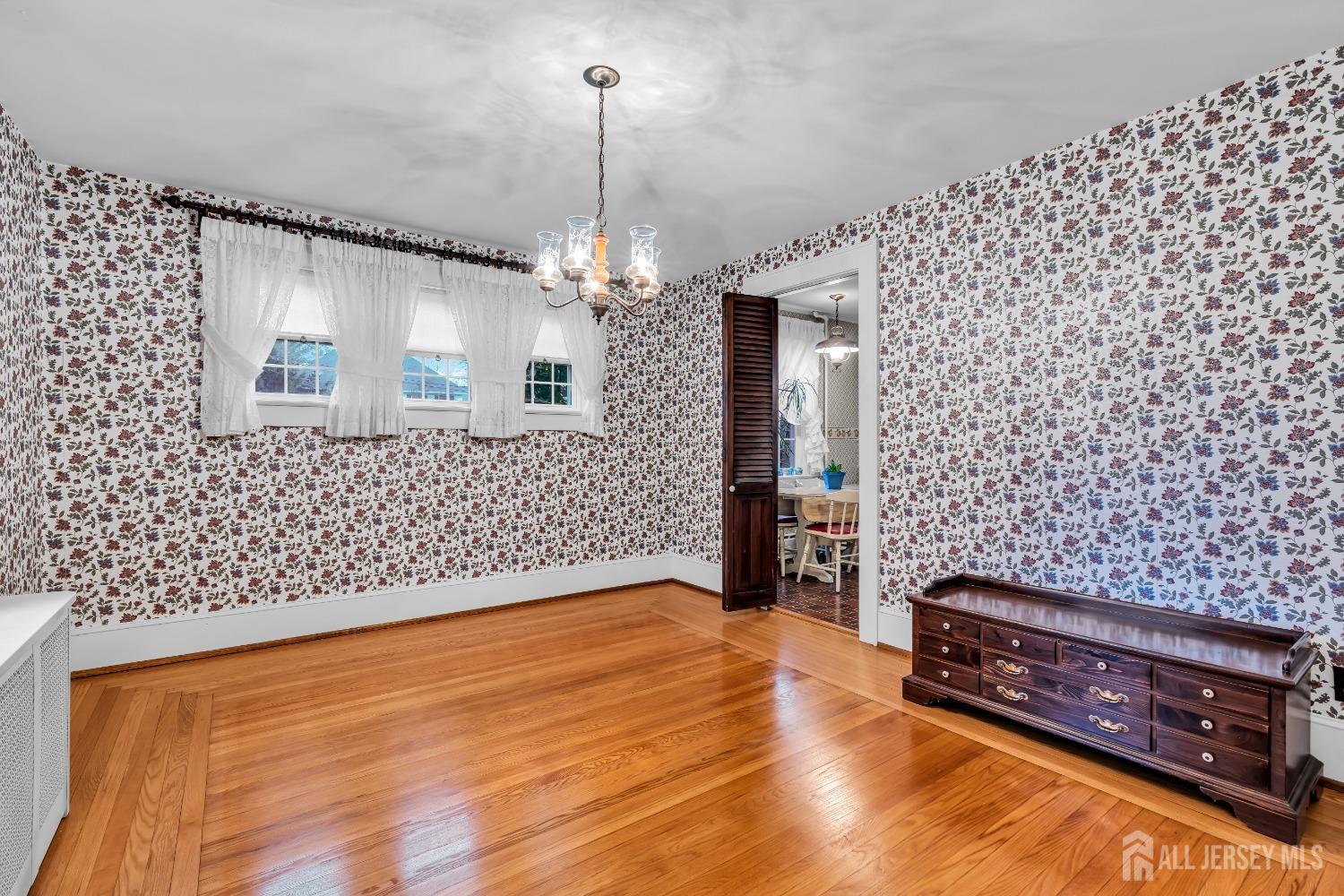 3 Edgemere Drive Matawan, NJ 07747 - Photo 10 of 43 a spacious bedroom with a bed and a chandelier