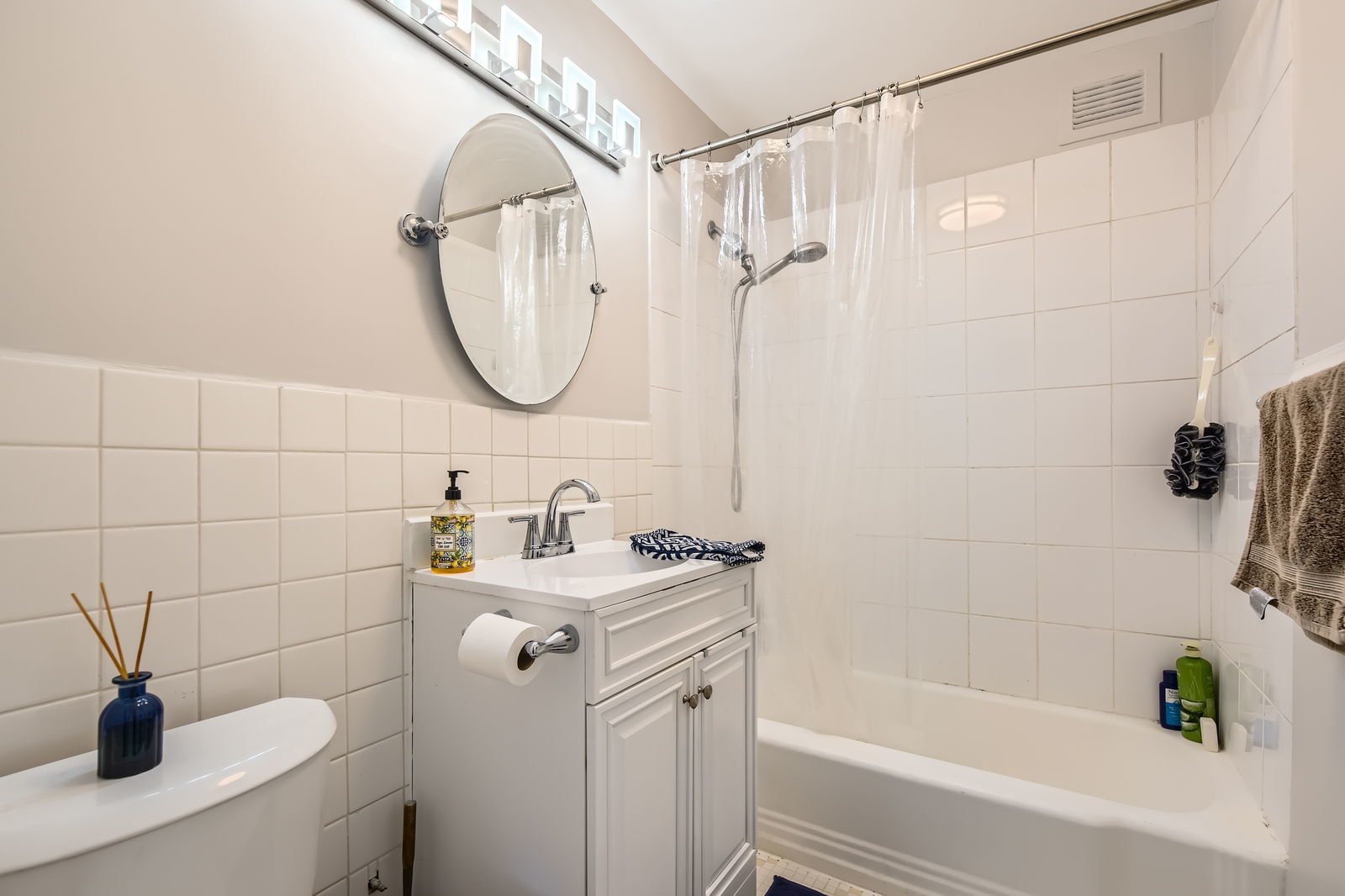 6301 North Sheridan Road, Unit 10F Chicago, IL 60660 - Photo 13 of 19 a bathroom with a sink a toilet and shower