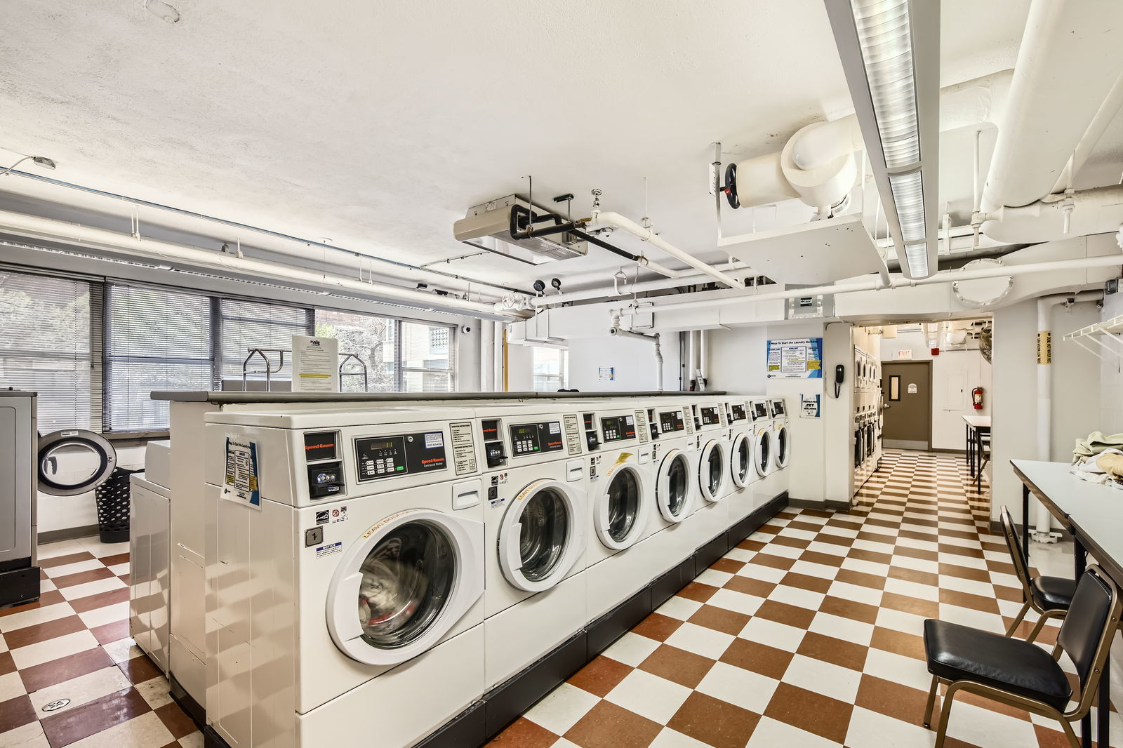 6301 North Sheridan Road, Unit 10F Chicago, IL 60660 - Photo 14 of 19 a utility room with multiple dryer and washer