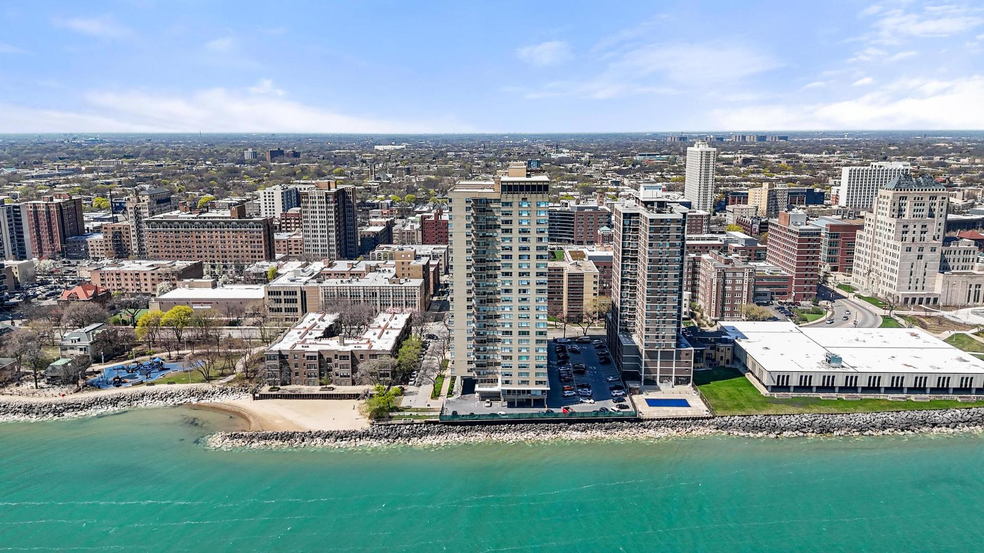 6301 North Sheridan Road, Unit 10F Chicago, IL 60660 - Photo 4 of 19 a view of a city with tall buildings