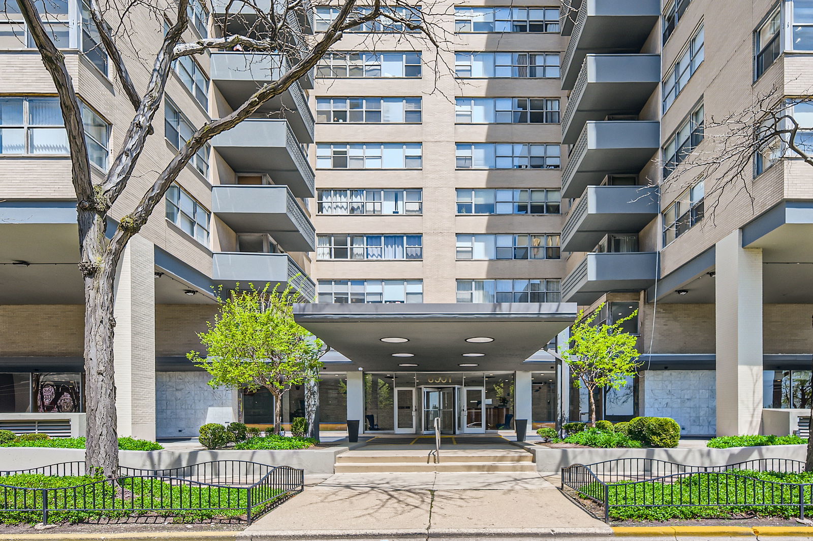 6301 North Sheridan Road, Unit 10F Chicago, IL 60660 - Photo 5 of 19 a view of a building next to a yard