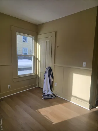 a view of a room with gym equipment and a window