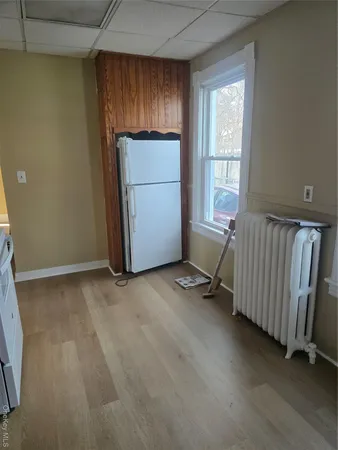 a view of a room with an entryway and a window
