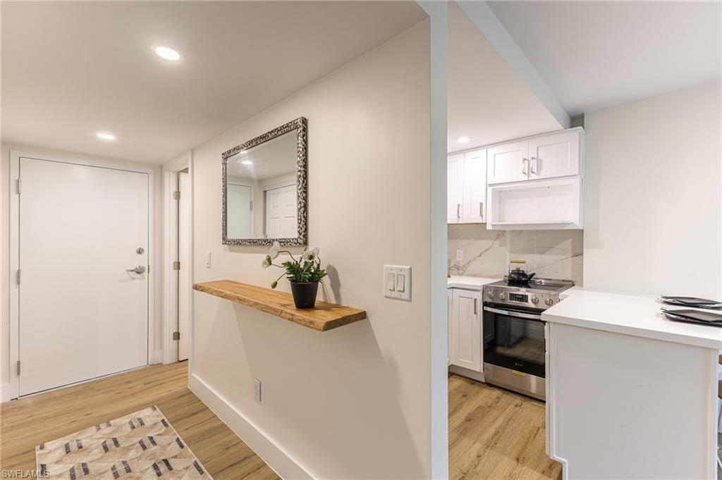 5 Bluebill Avenue, Unit 105 Naples, FL 34108 - Photo 16 of 26 a kitchen with a sink and appliances